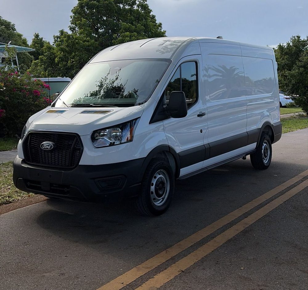 21 Roads white Ford Transit cargo van parked and ready for delivery